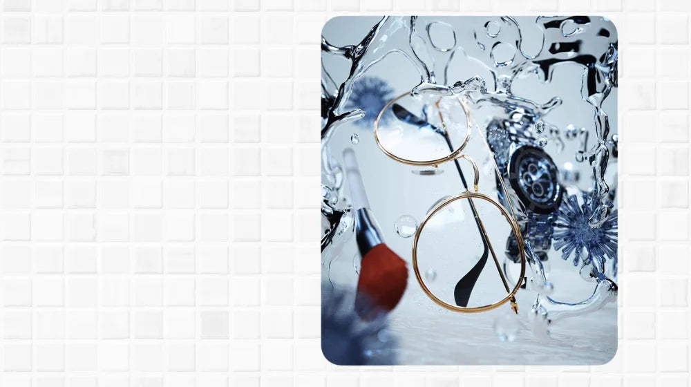 Eyeglasses and a watch submerged in water during Shinevo ultrasonic cleaning process, highlighting deep cleaning with water splash effect.